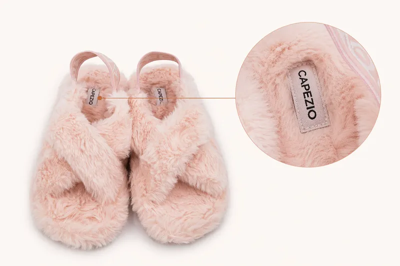 Custom plush slippers with woven label logo and close-up detail