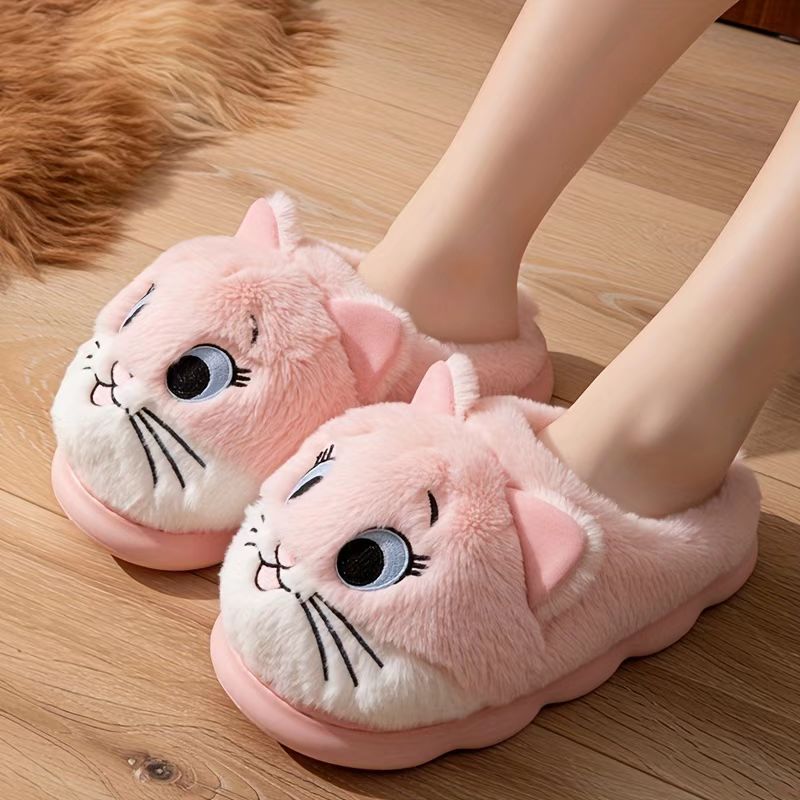 Applique and embroidered details on character plush slippers